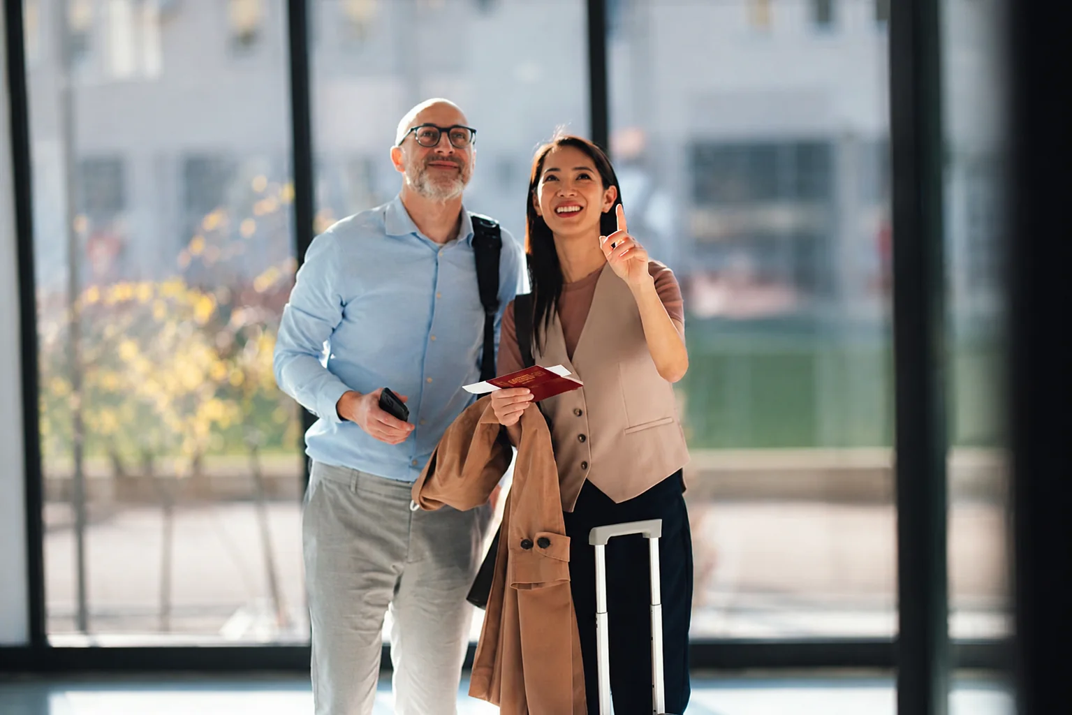 Couple meeting for an international date at an airport