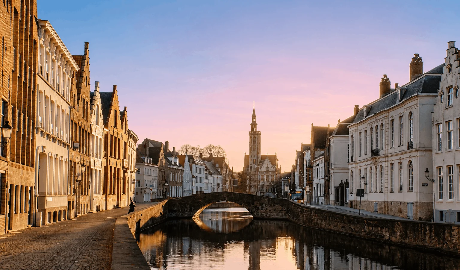 Historic canal and stone bridge in Bruges, Belgium